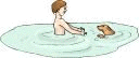 boy and dog in water
